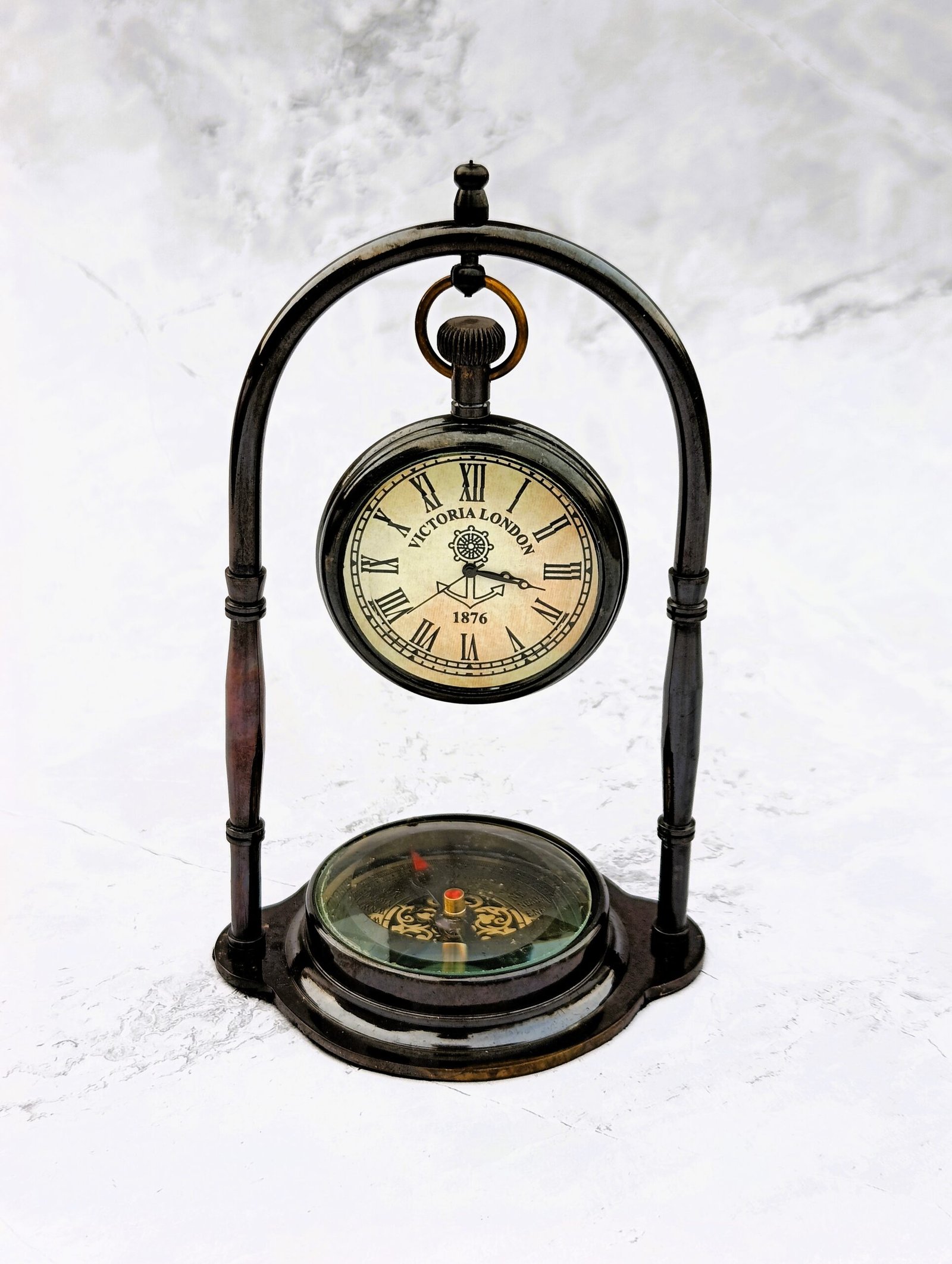 Close-up of custom engraving on brass desk clock back dial